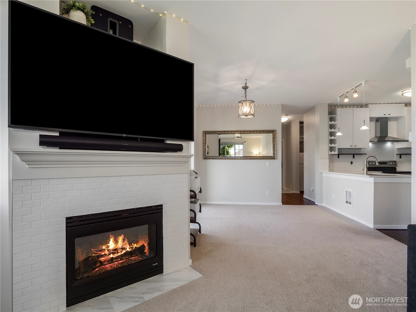The light and bright kitchen opens to the dining area and family room.