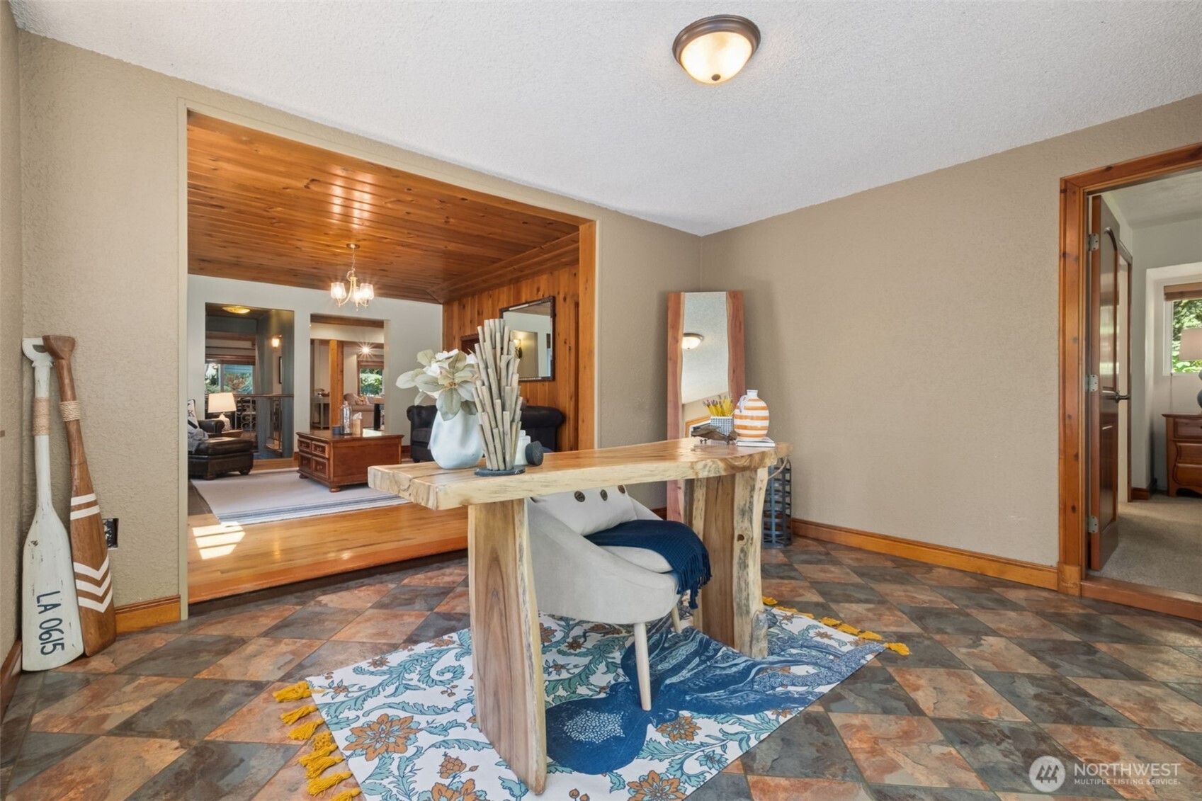 Office/den opens up to the huge beautiful deck with views of nature and the lake.
