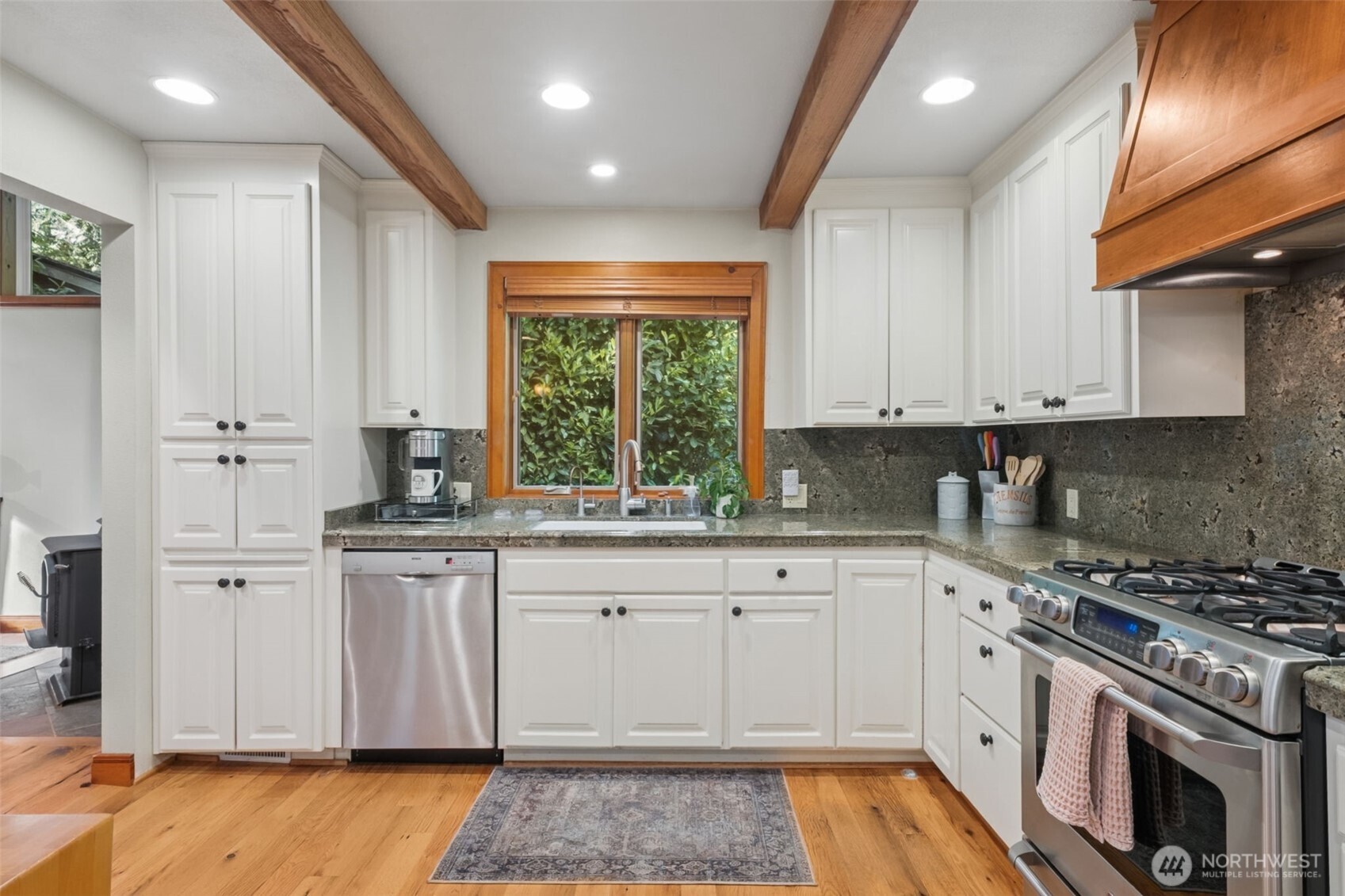 Beautiful Kitchen with Stainless steel appliances and granite countertops.