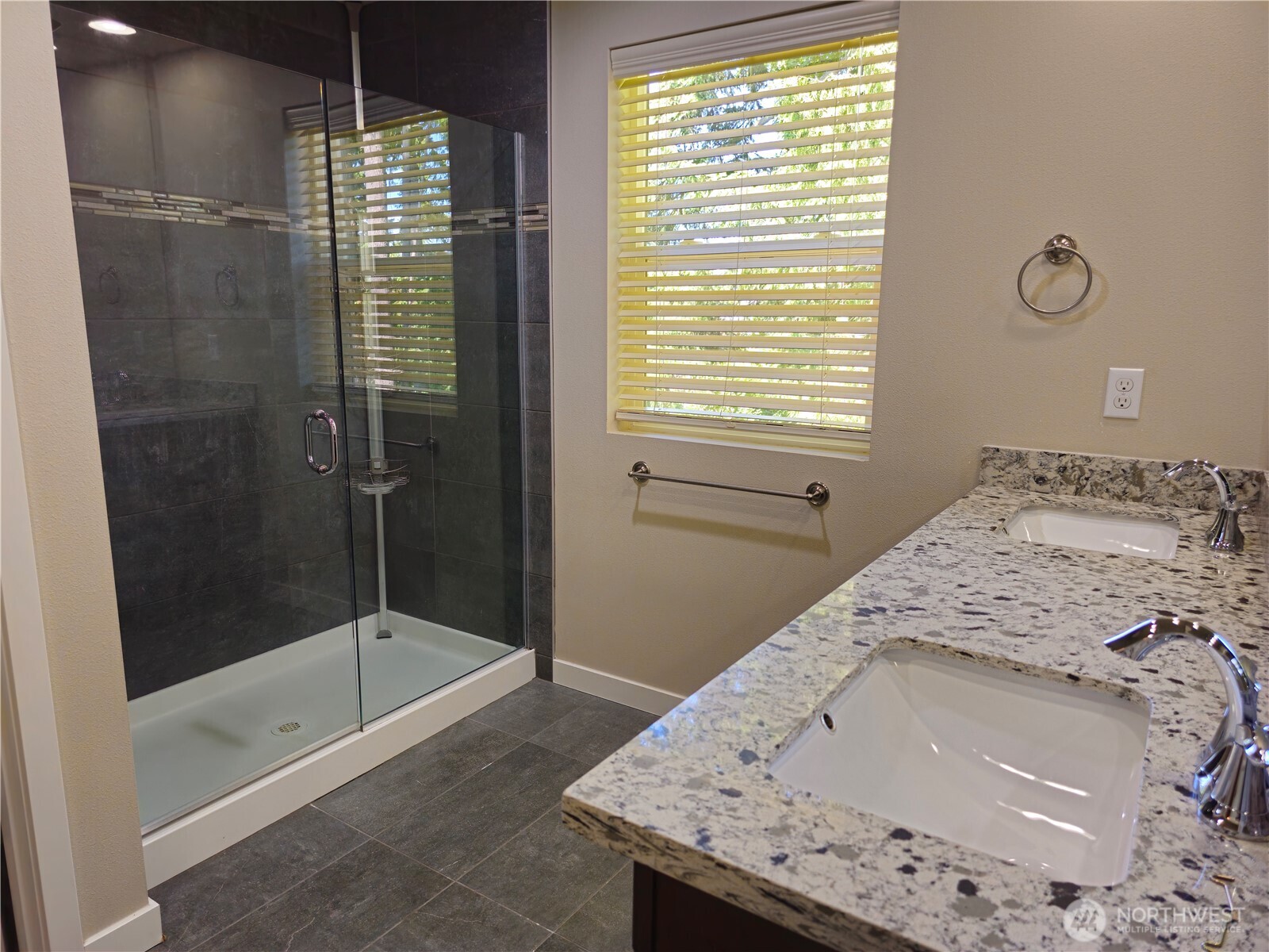 A step-in shower and double sink vanity are just off the master suite.