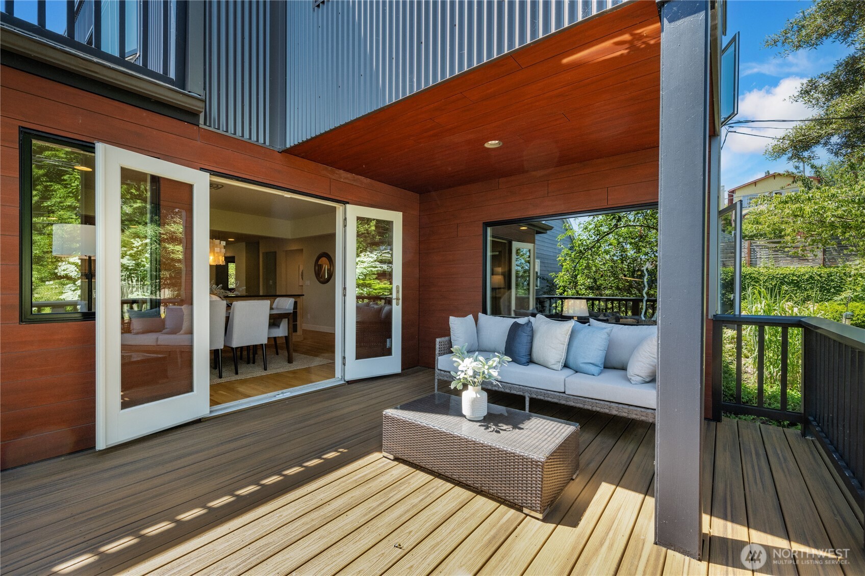 Peaceful and private deck off the dining area with filtered views of Lake Washington