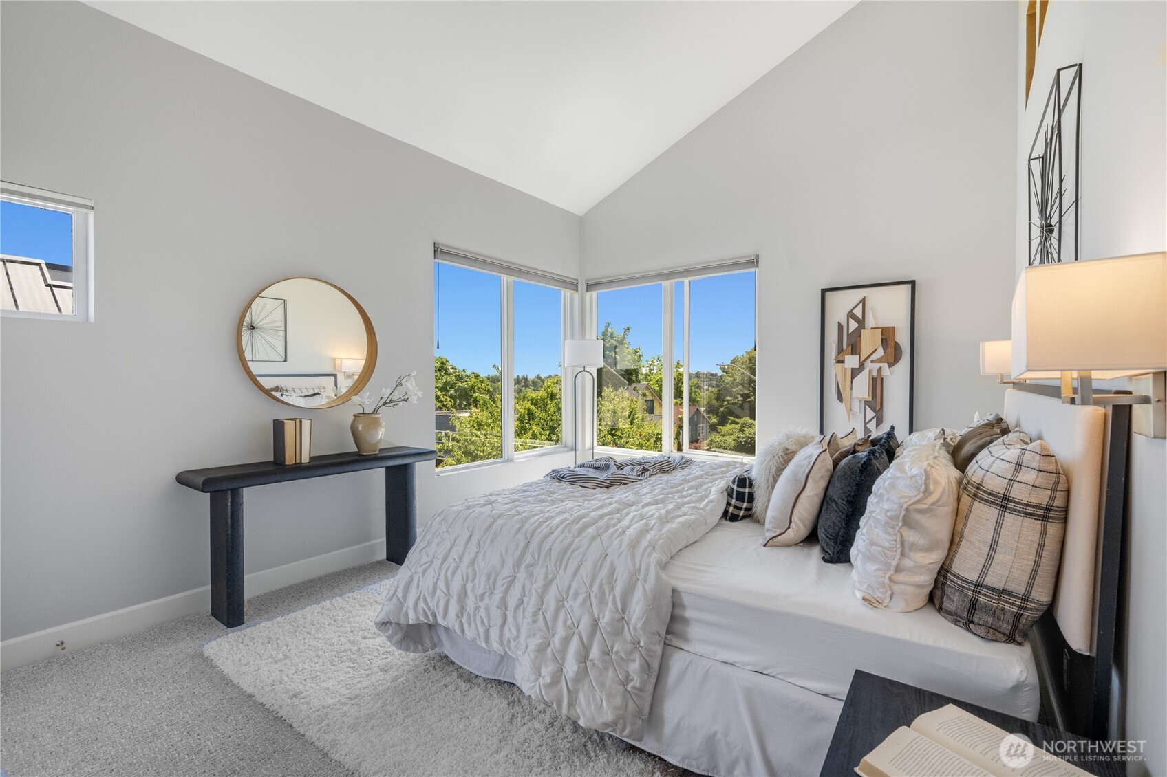 The large souteast corner windows capture views of the Bellevue skyline and filtered views of Mt Rainier