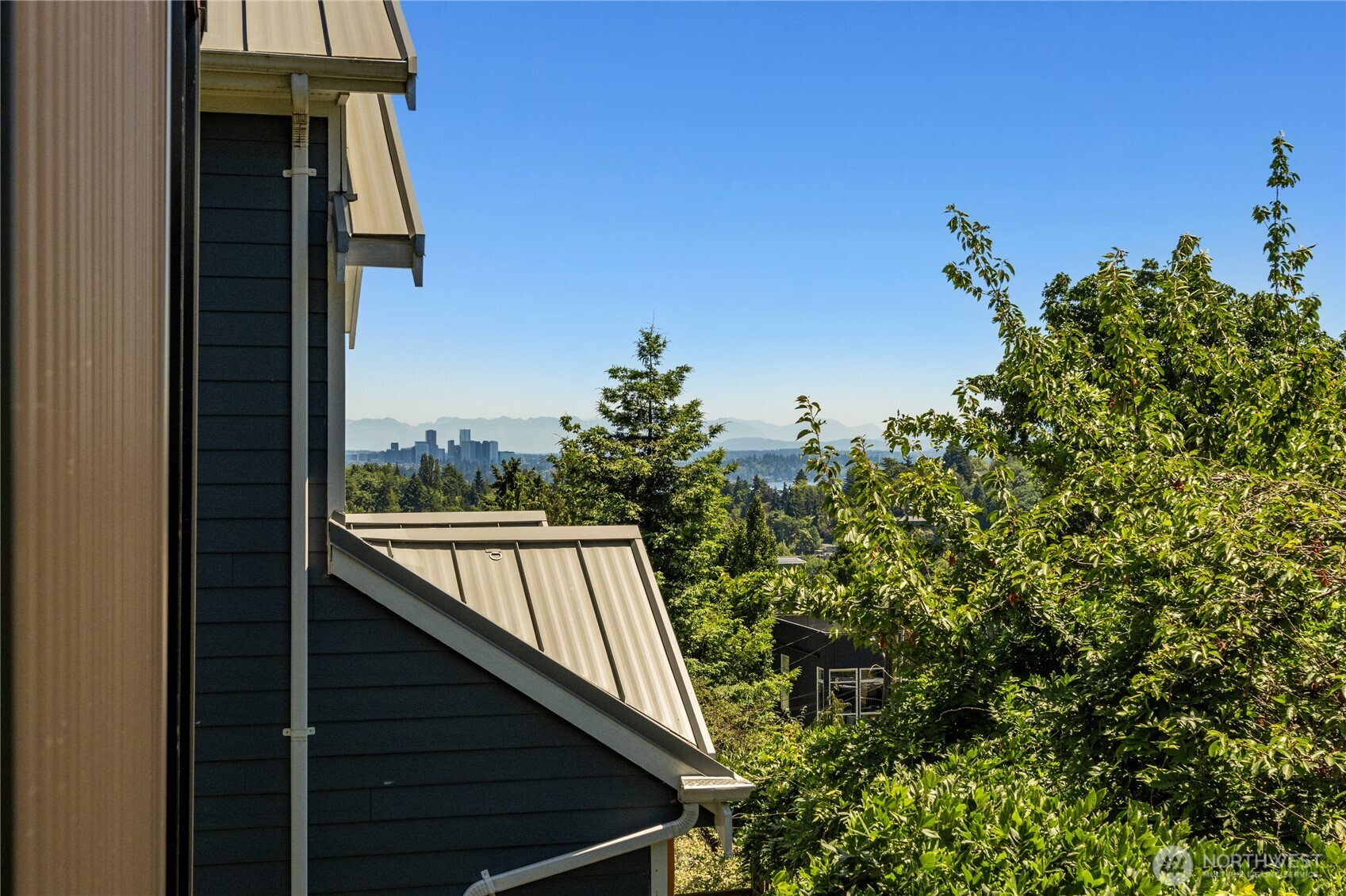 Pocket views from many rooms through out the home. This one captures the Bellevue skyline and Cascades