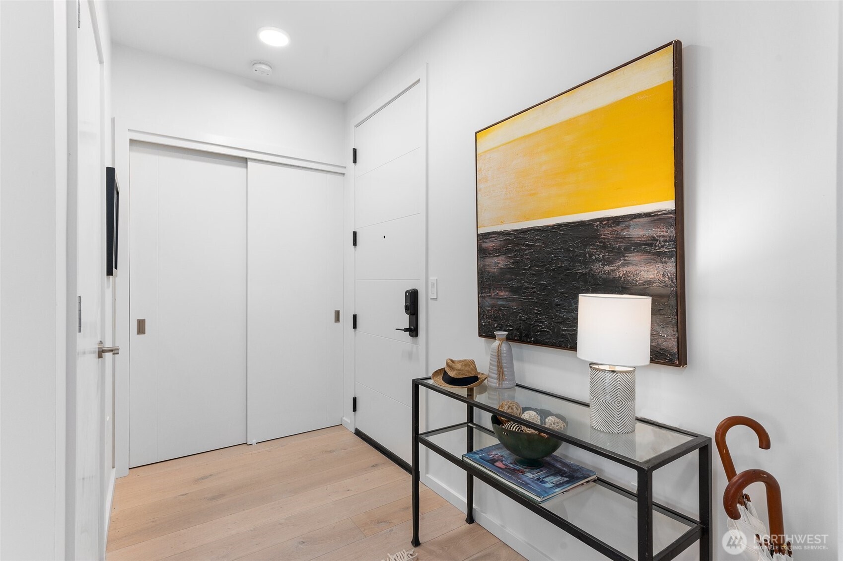 Entry closet and utility closet features the units hot water heater