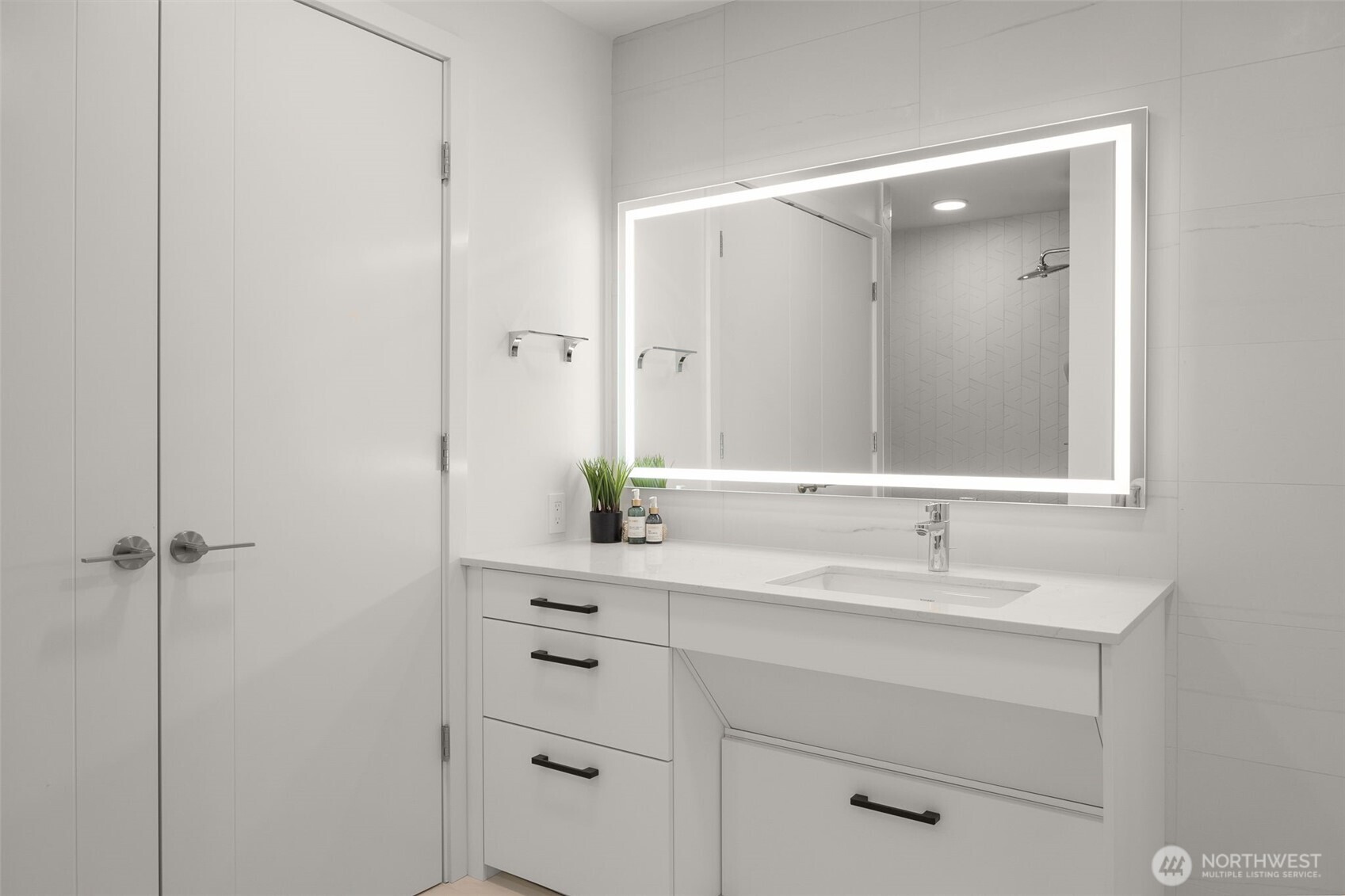 Bathroom features an in-unit Miele washer and dryer