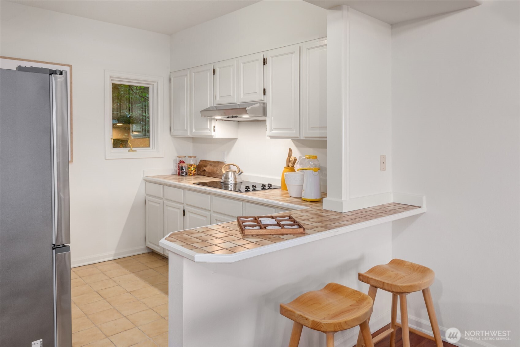 The second kitchen with eating space on lower level, perfect for nanny, guests or extended family.