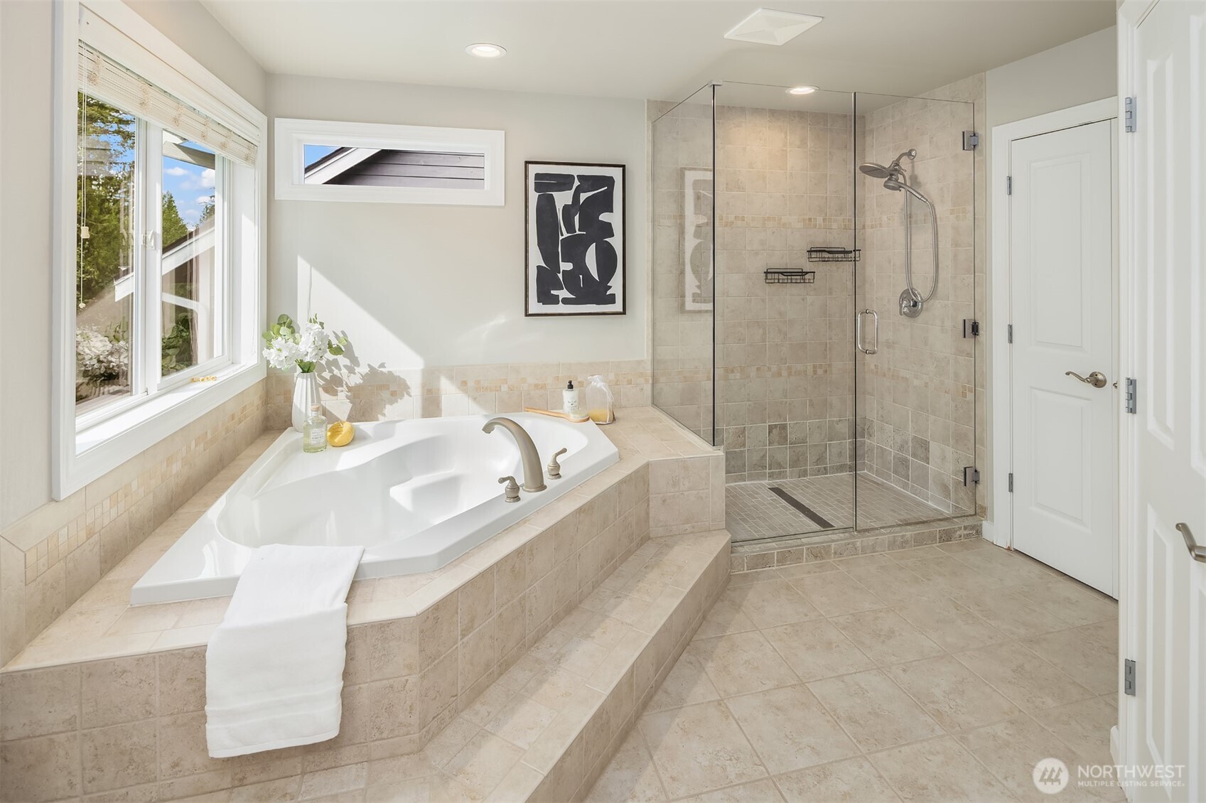 Spa Primary bath with soaking tub and large shower. Multiple closets offer plenty of storage.