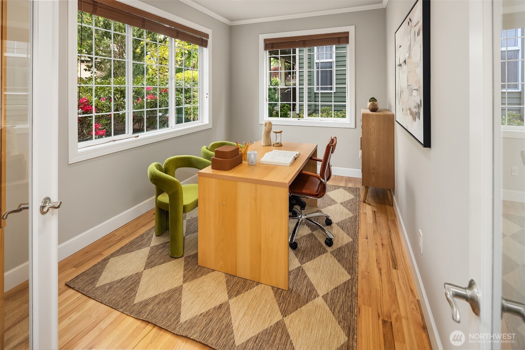 Main level Den off the entry with hardwood floors and large windows. Drenched in morning sunlight.