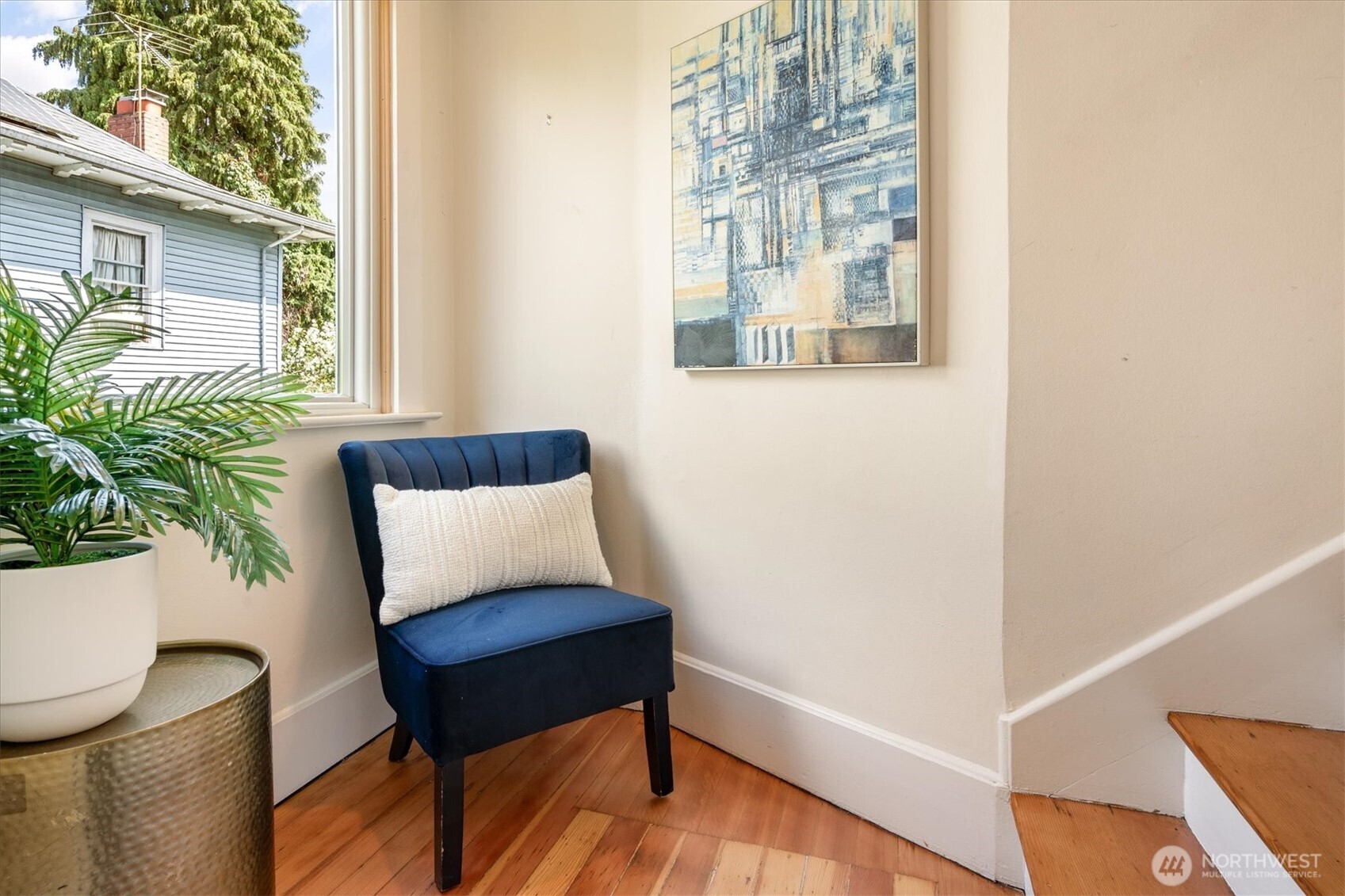 Primary bedroom w/ charming leaded glass French doors.