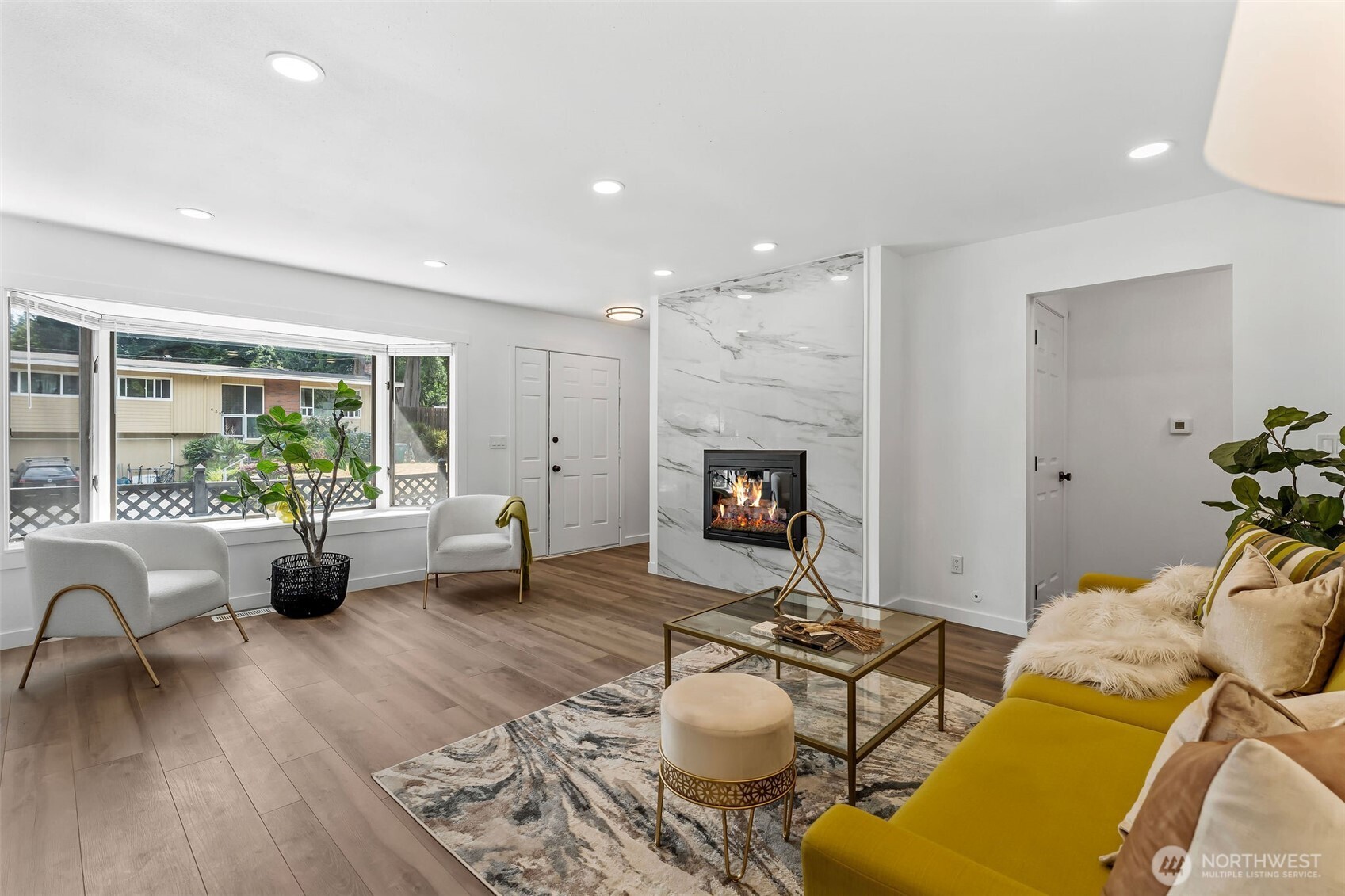 Living room area w/tiled fireplace fireplace with Tile
