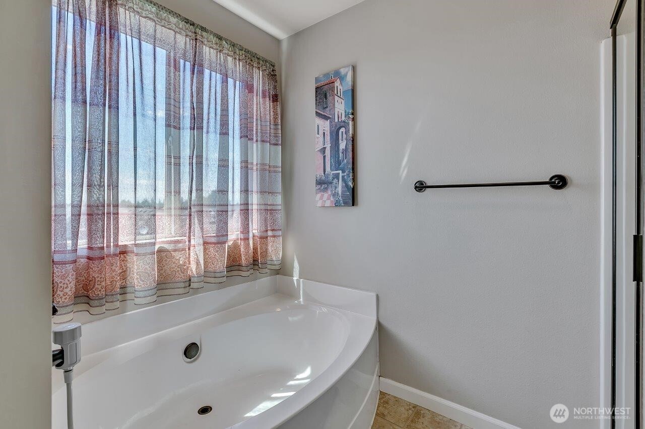 Nice sized soaking tub in primary bath