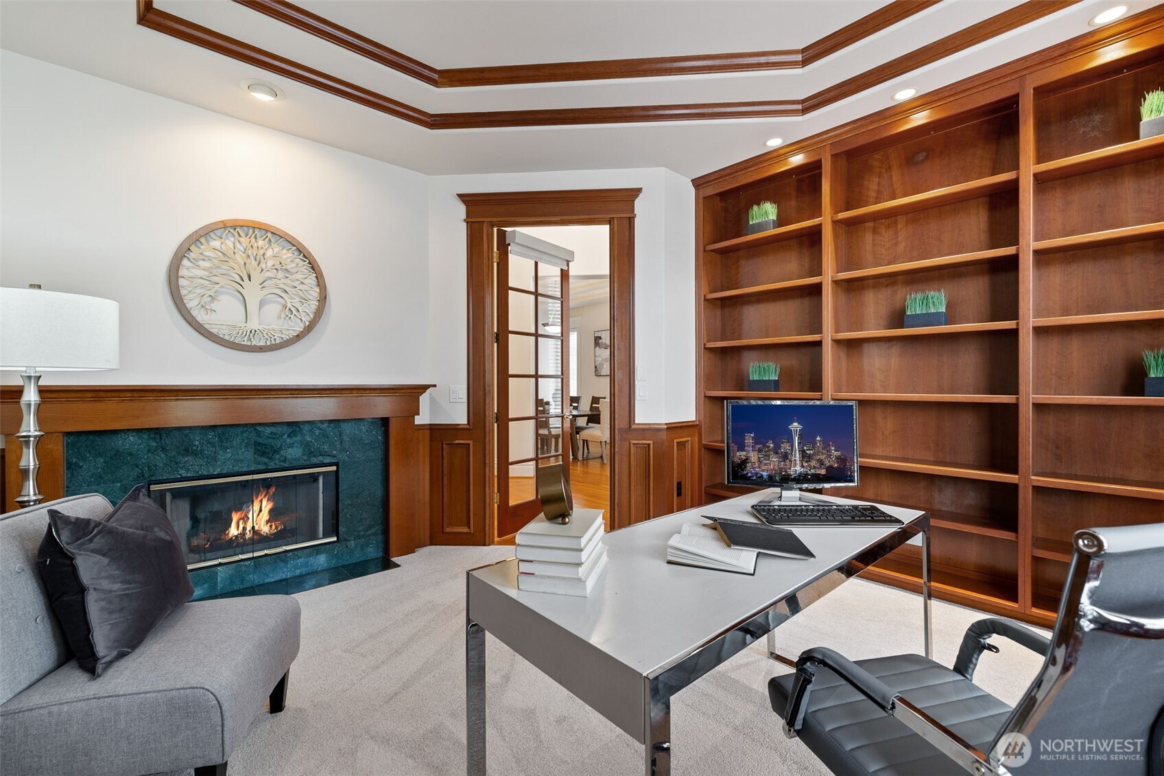 Office with gas fireplace and beautiful built-in book shelves.