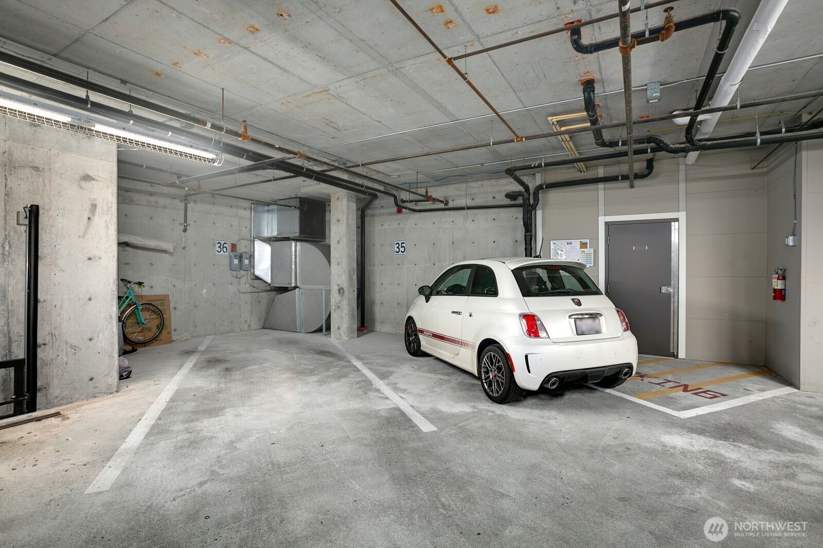 Two parking spaces + room to store items