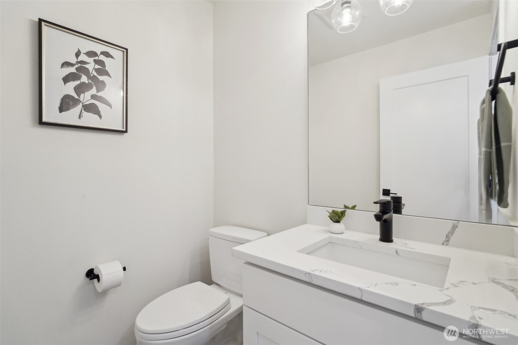 Photos of staged unit, 20313A. Level 2 half bath