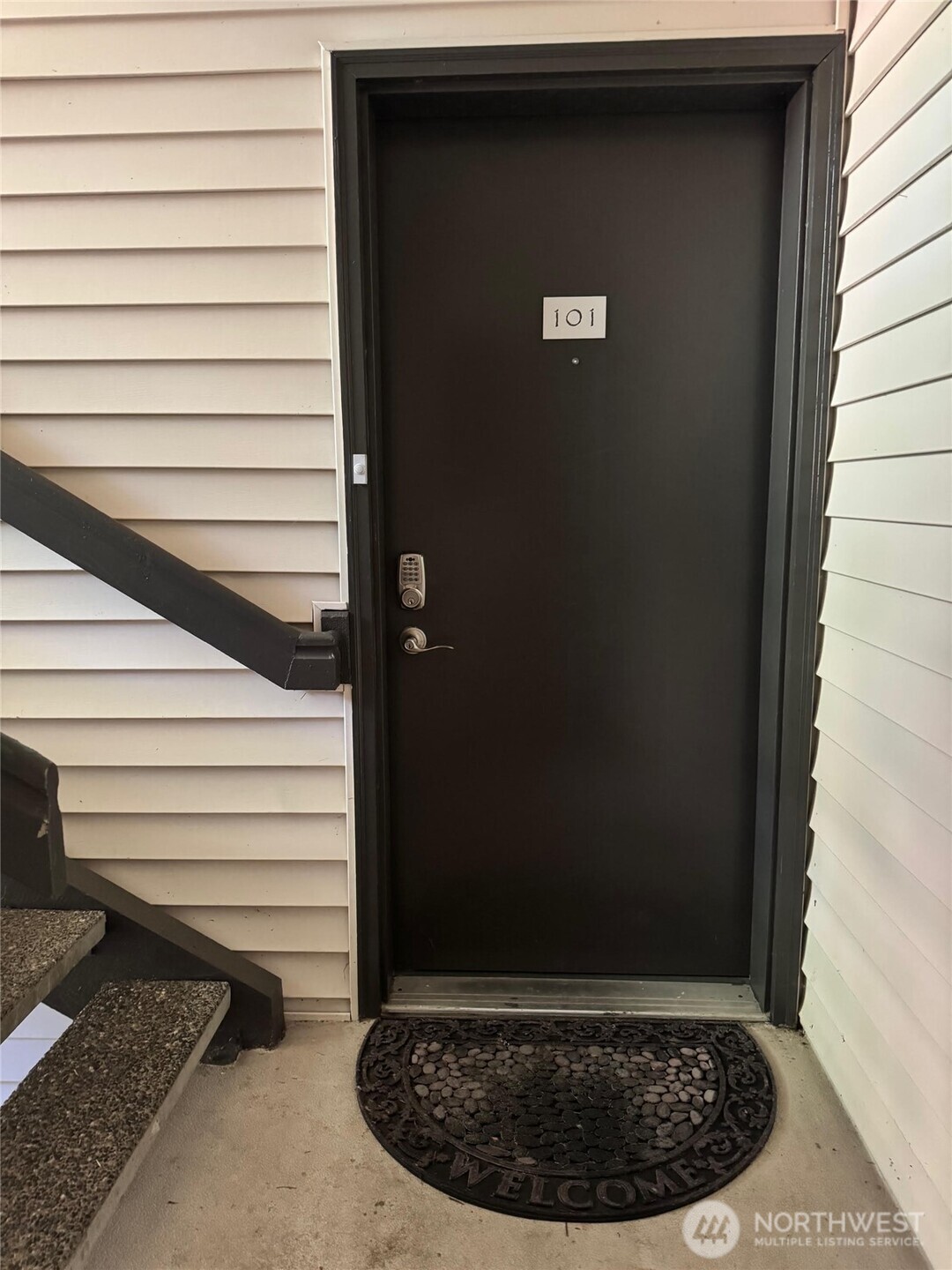 Garage with separate storage area (room with opened door).