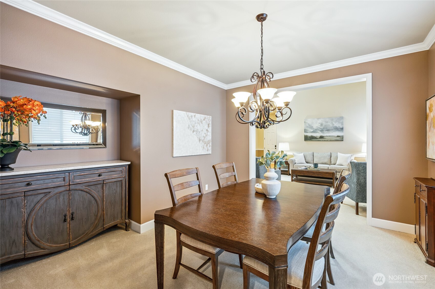 Crown molding, refined finishes, and nook area in the dining room.