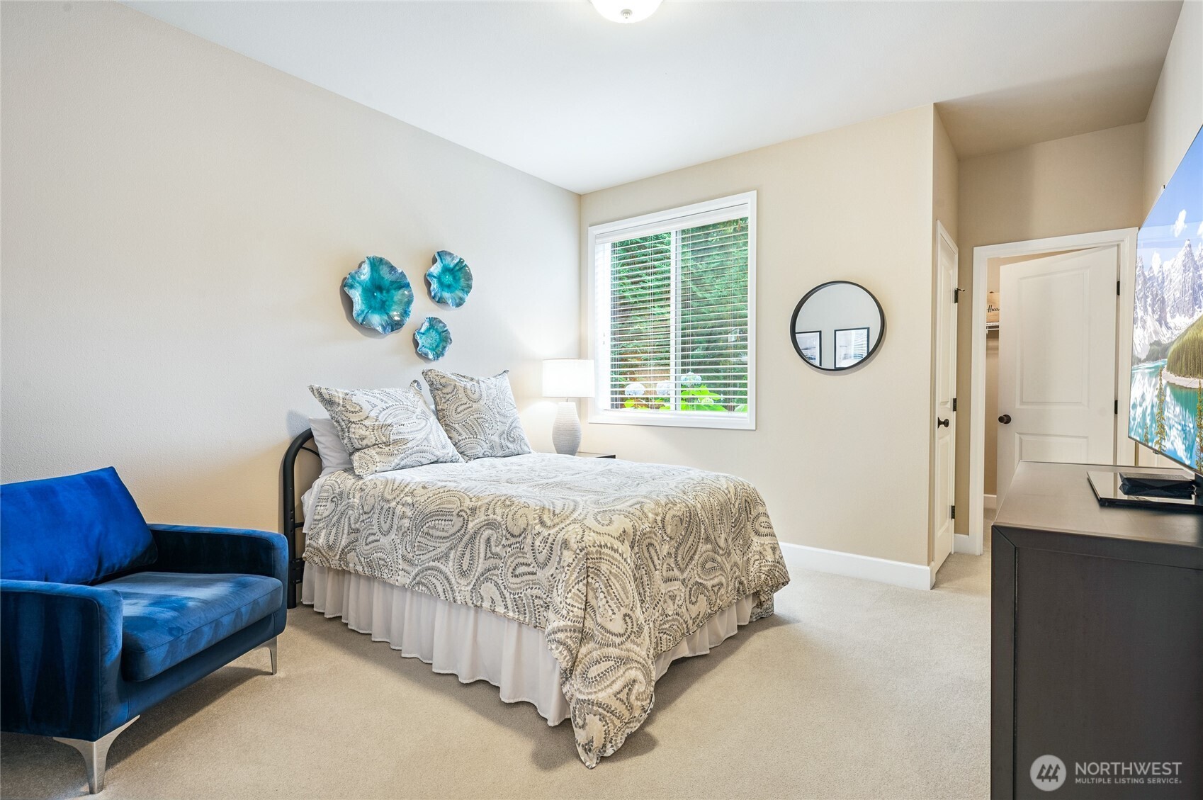 Main-level Guest Suite with ensuite, and walk-in closet offers privacy and comfort combined.