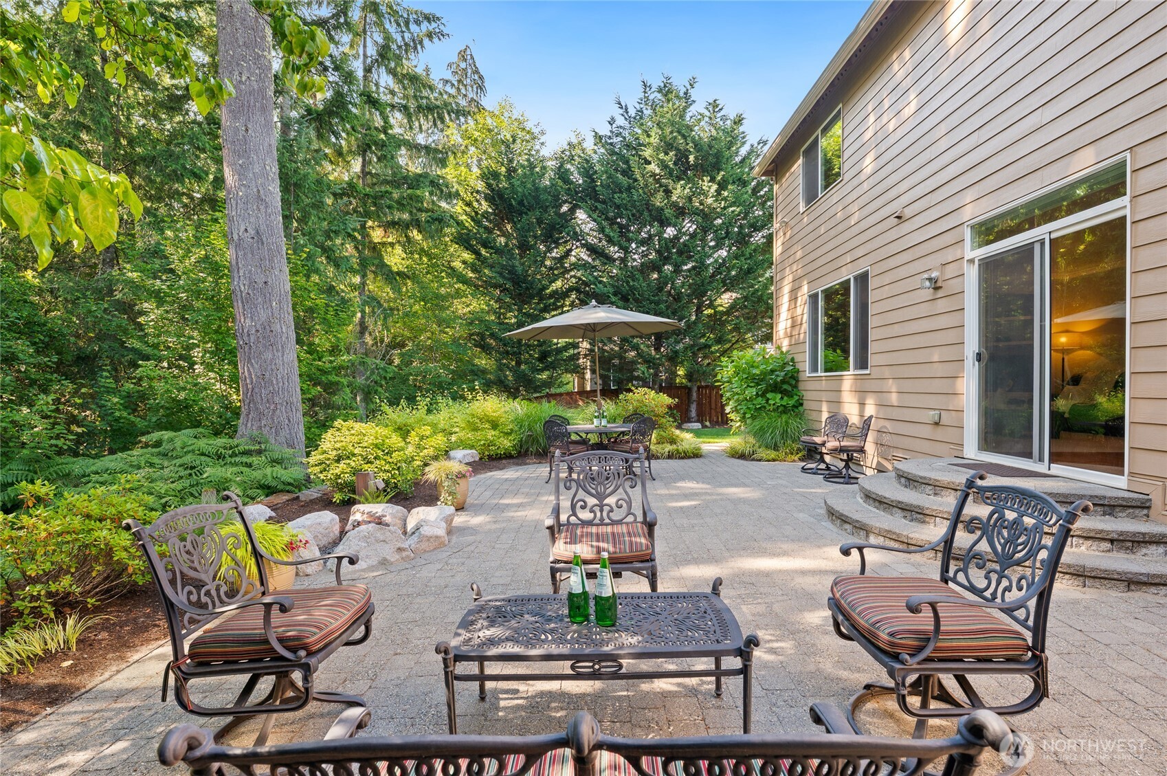 Spacious stone paver patio for al fresco dining. Surrounded by nature.