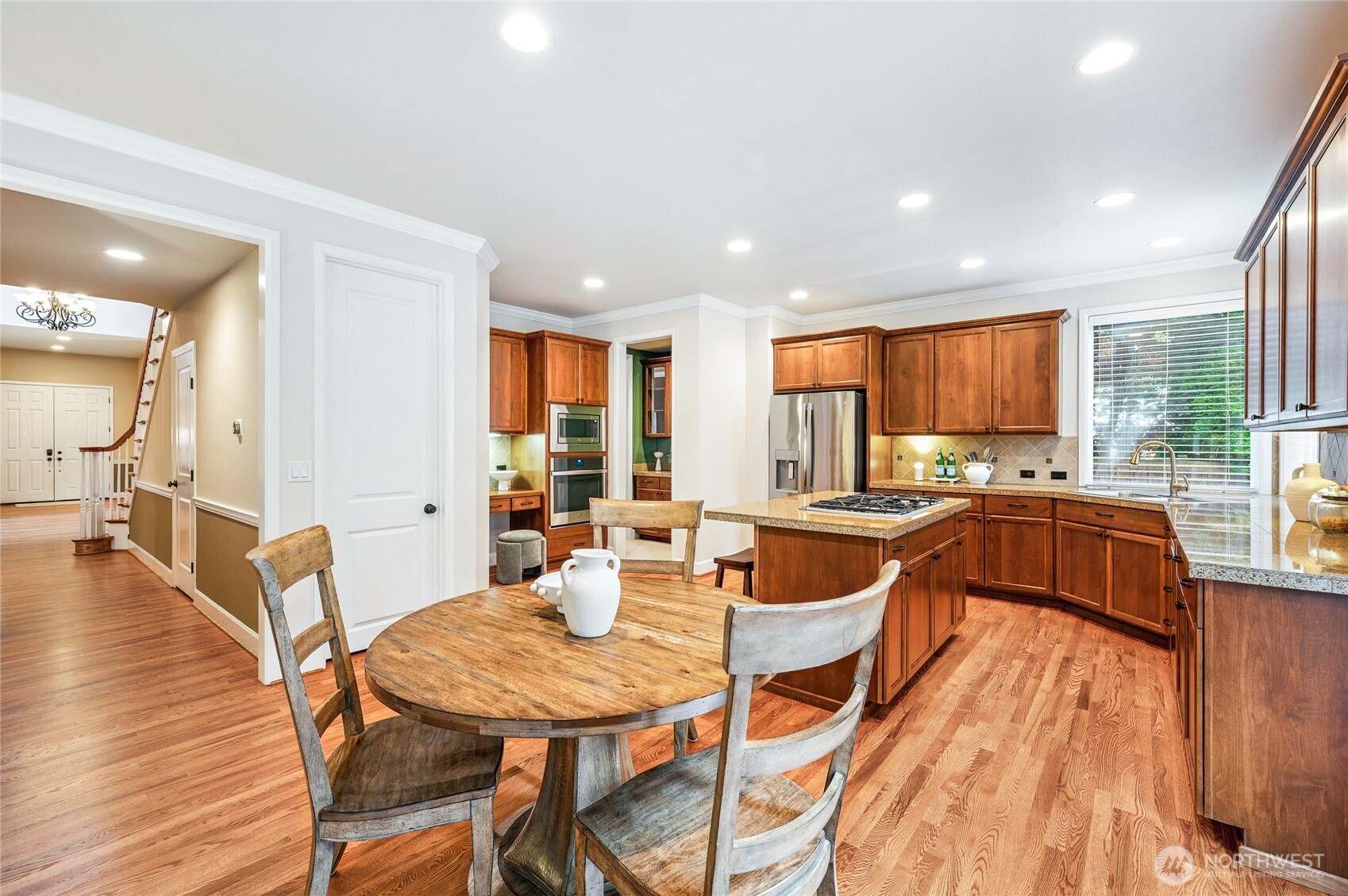 Bright, open-concept kitchen with granite counters.