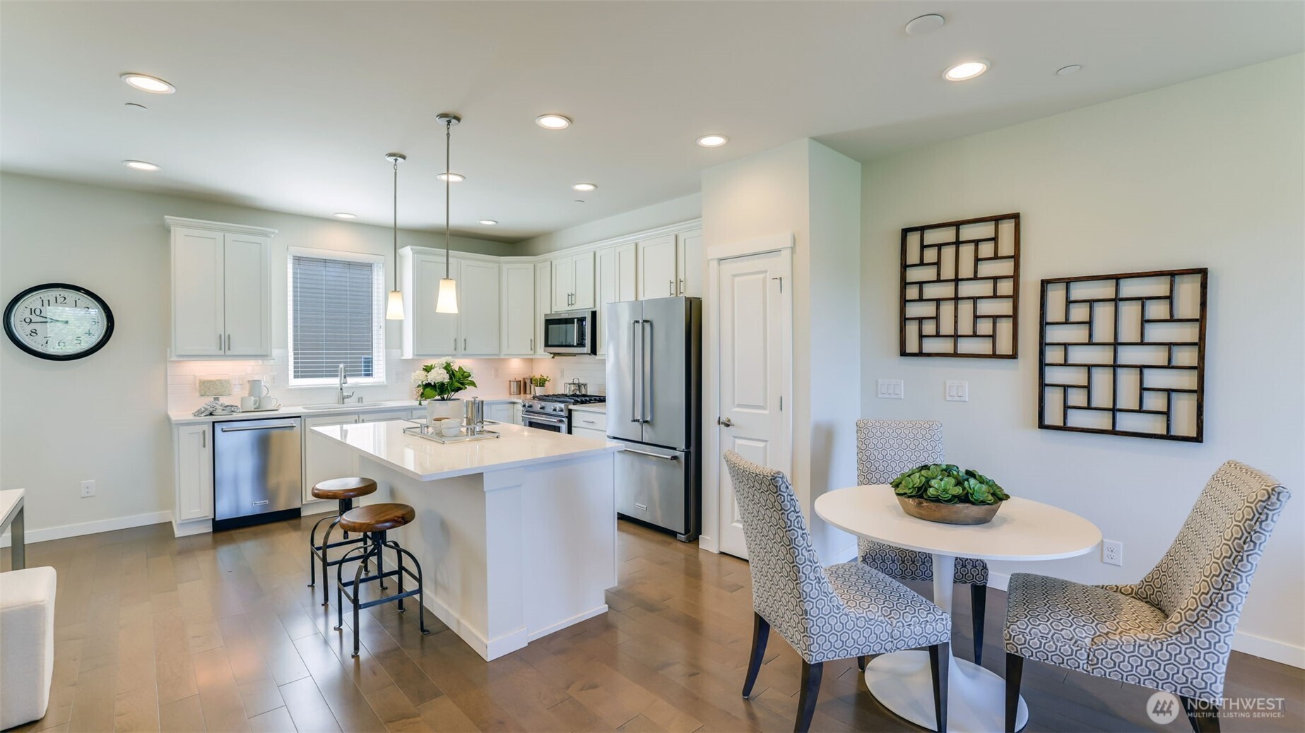 As you approach the main level this is the first view of the gorgeous kitchen and dining area.