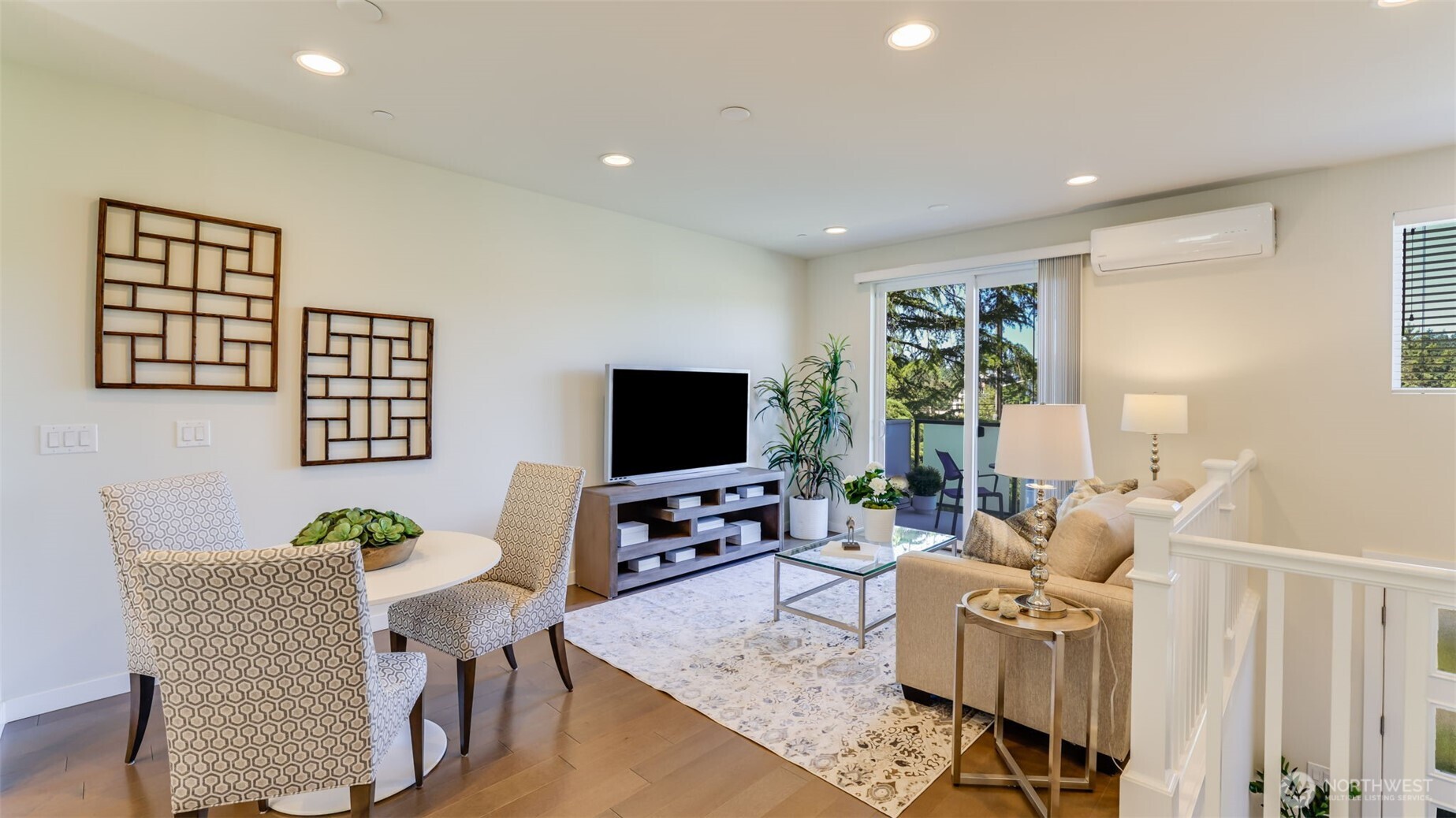 You see the room that can be used as a family or living room. A large glass sliding door takes you to a spacious deck that is perfect for morning coffee or relax.