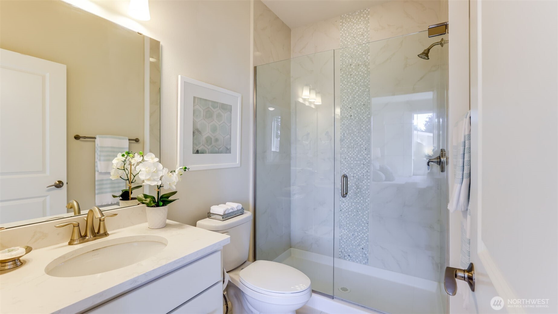 The primary bath has a large glass shower. Well appointed and in excellent condition.