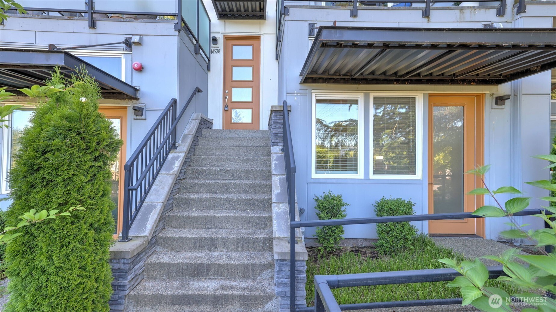 The 2-car garage is on the drive behind the building. The garage is spacious and extra tall for loads of storage.