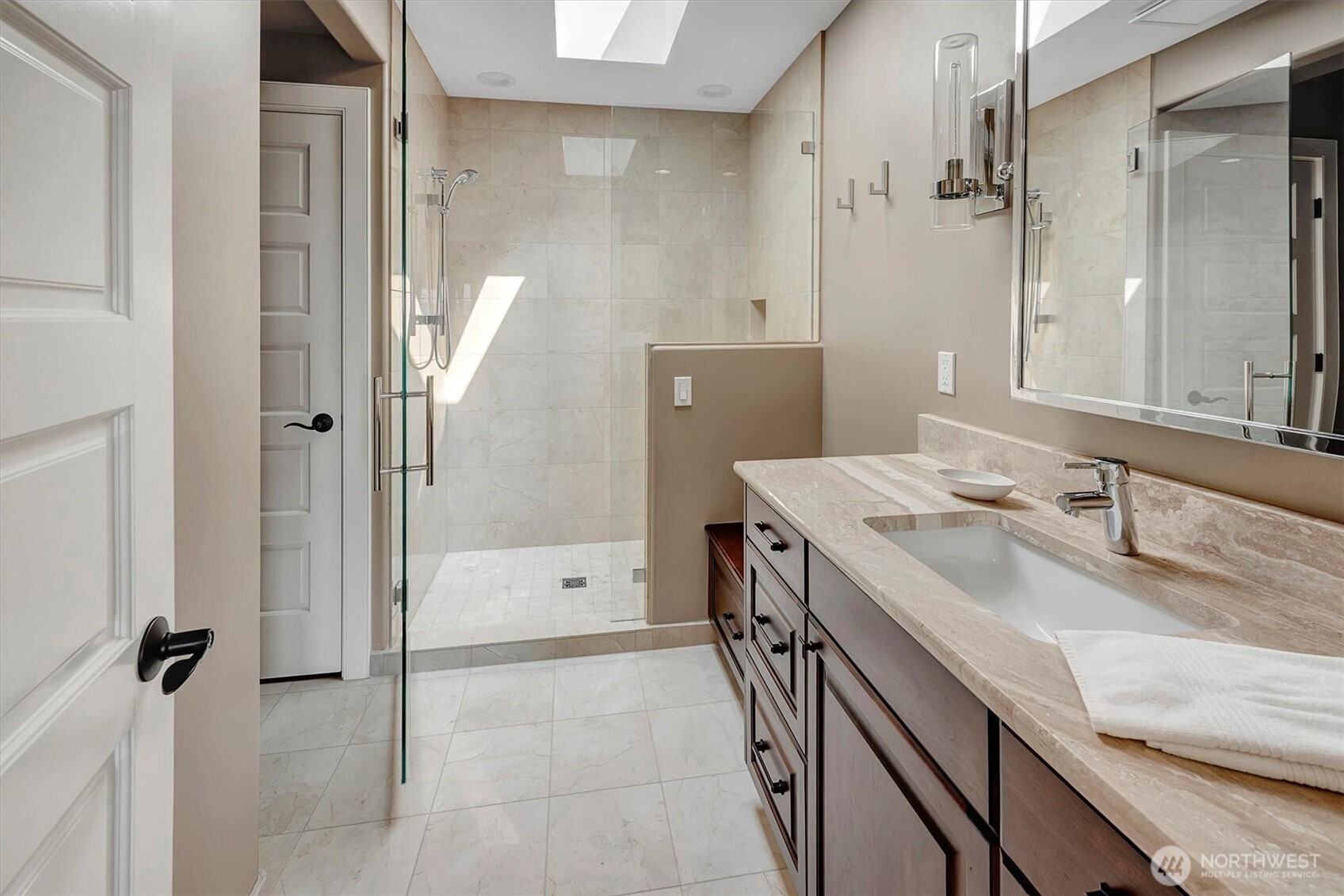 Italian marble shower in guest bathroom. All showers have built a in bench