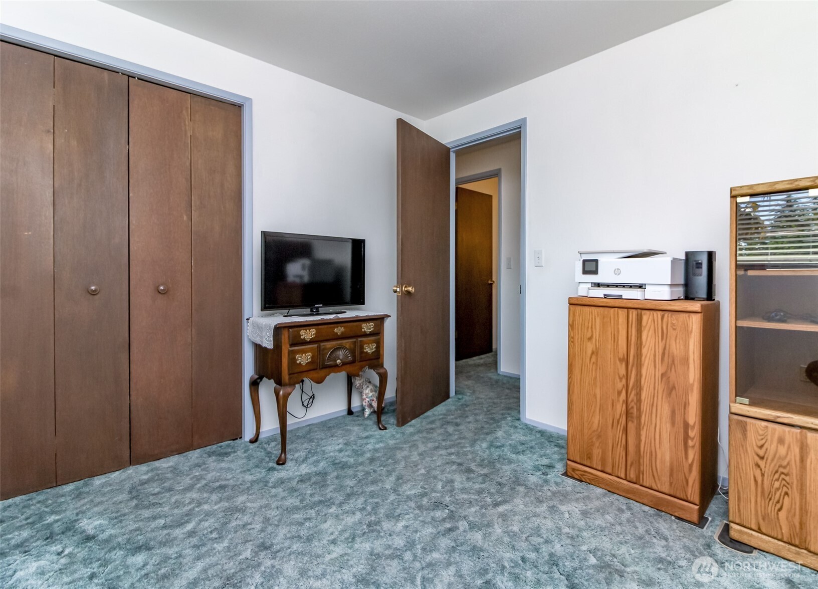 Bedroom 3. Hardwood floors under carpet have been covered since 1970's