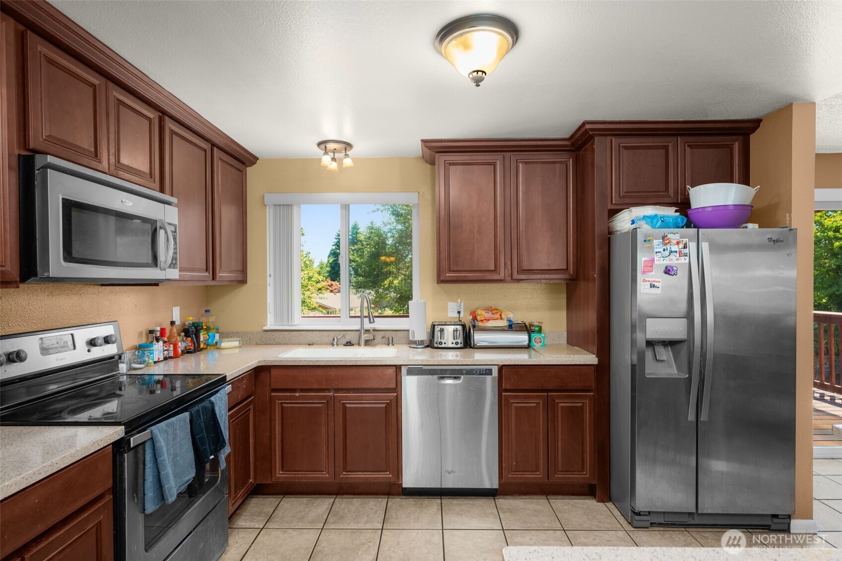 Large L shaped kitchen with tile floors