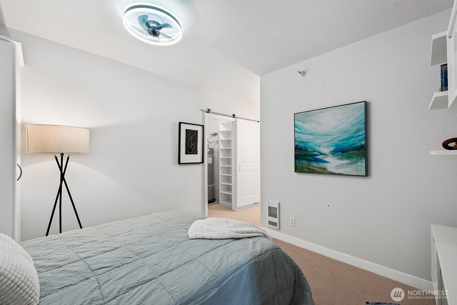 Big walk-in closet holds the water heater and has plenty of storage space.