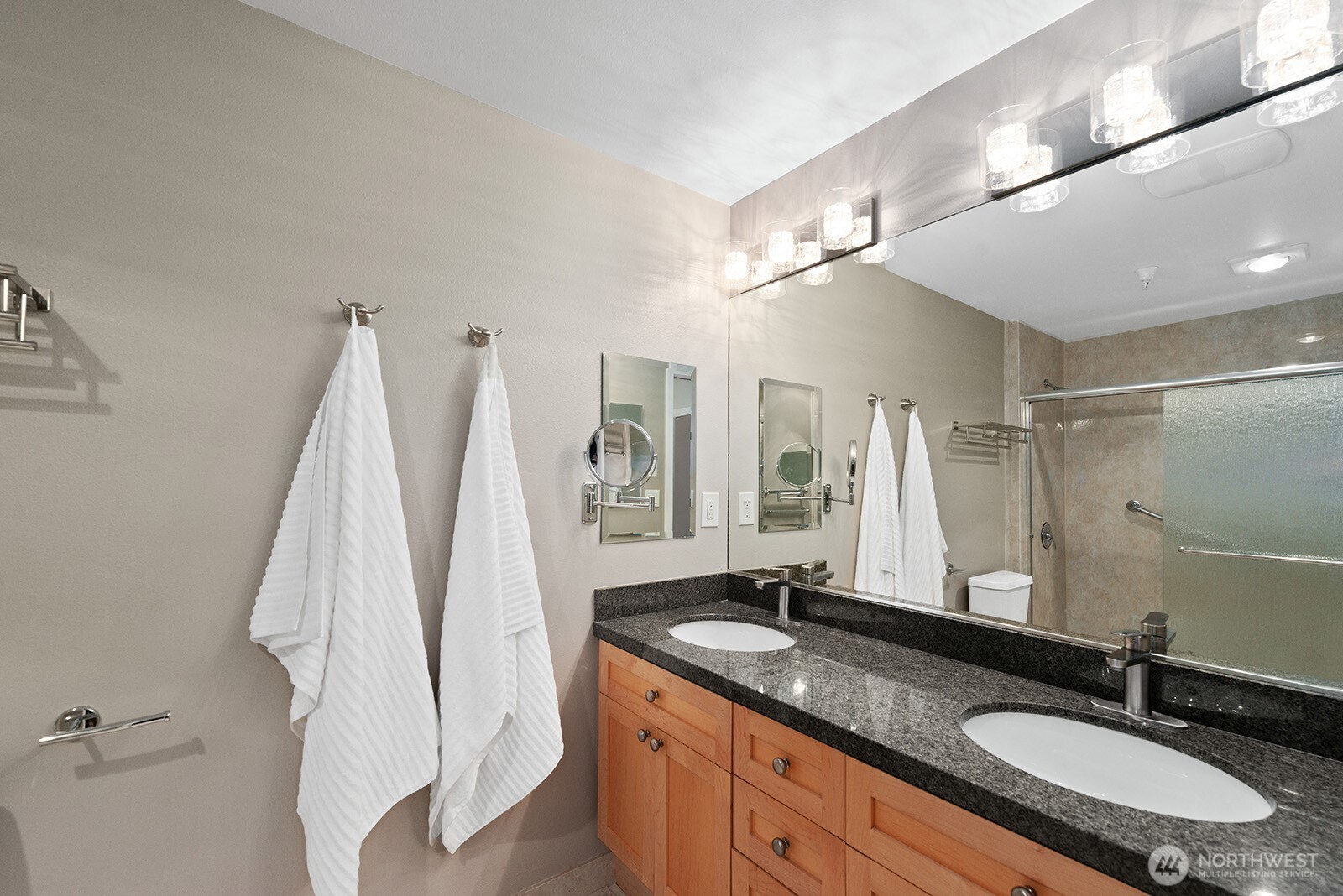 Double vanity, great lighting and a huge stall shower plus excellent storage.