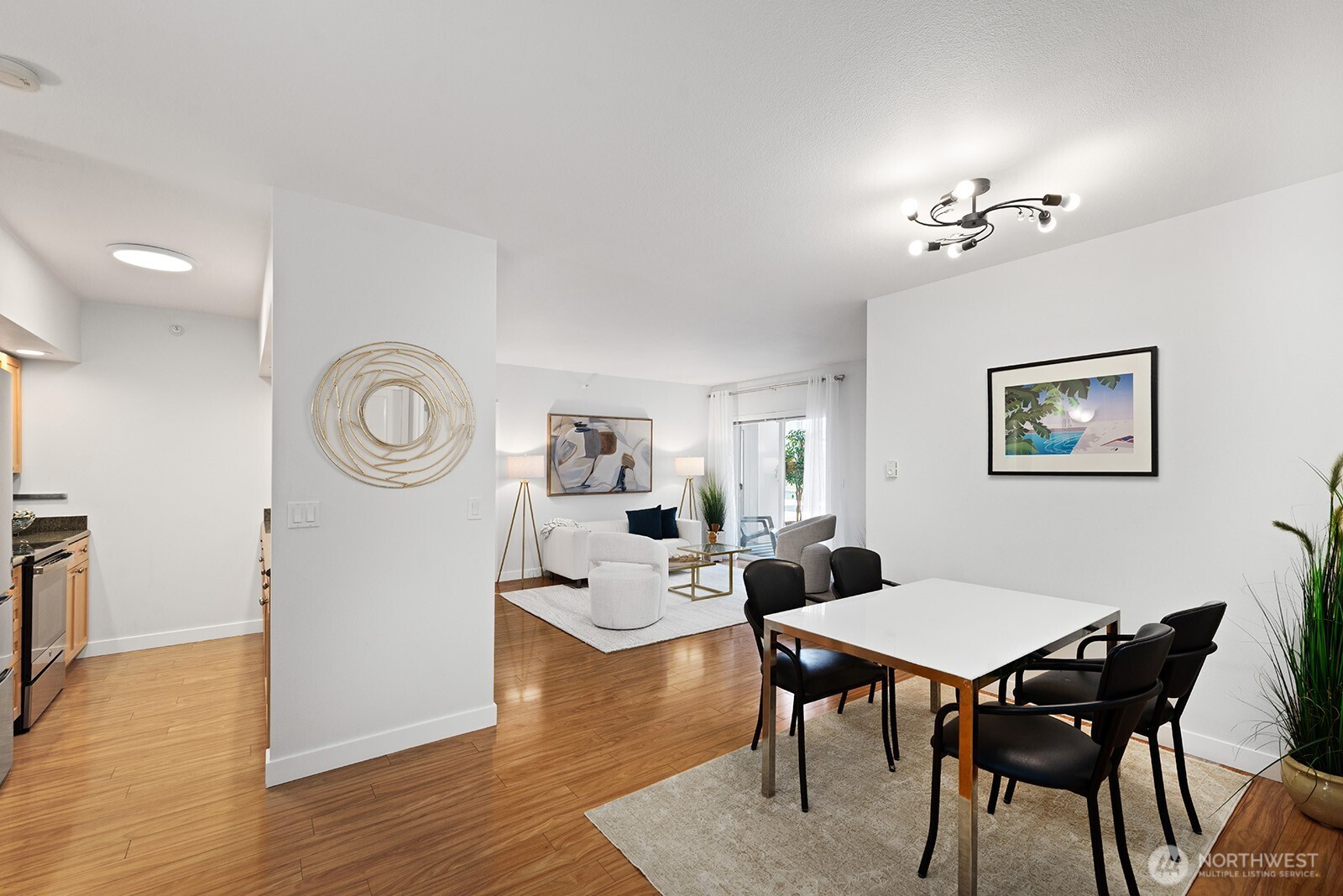Easy kitchen access from the formal dining space. The table is set for four but can accommodate a much larger group.