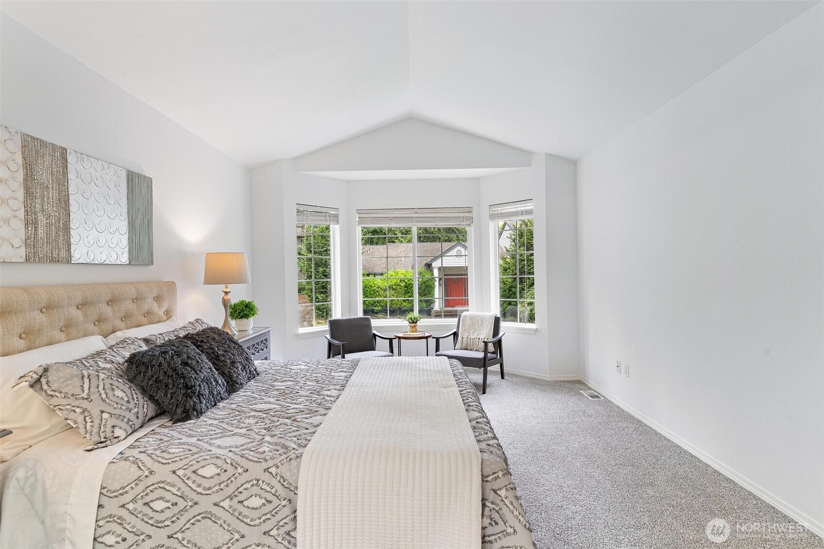 Primary bedroom boasts a bay window with sitting area and a 5 piece private bath.