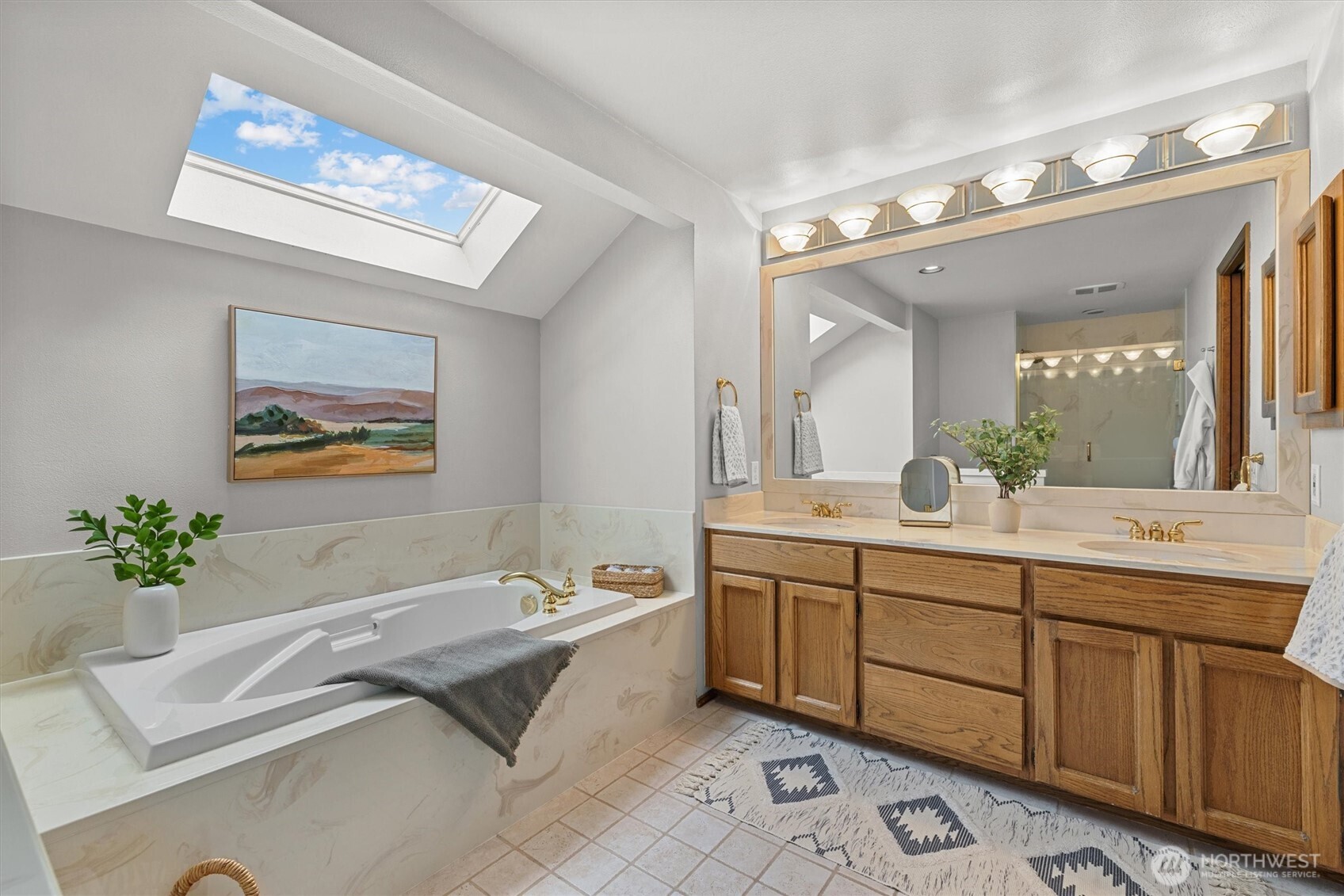 The primary bathroom has plenty of room to share. You will love the soaking tub, so very relaxing!