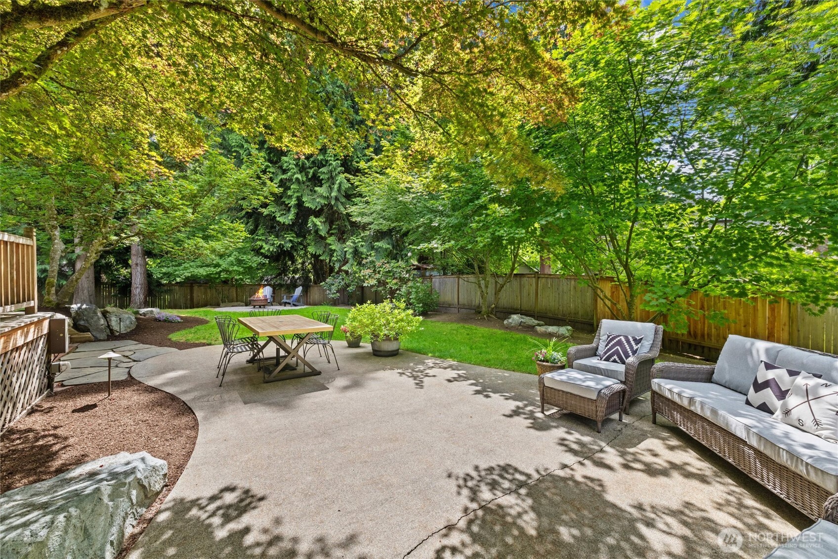 Frankly, the beautiful back yard made it difficult for the owners to sell this home. You will fall in love with the sweet ornamental trees and manicured landscaping. Sit by the fire pit on a summer night or enjoy a bbq with family and friends, this is truly a special place.