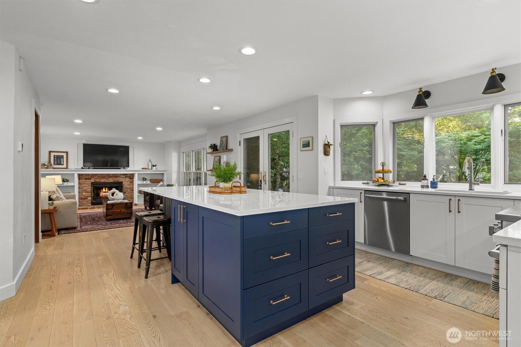 Not just a space to cook with additional storage, the island's under-counter seating is so very convenient for day to day living!