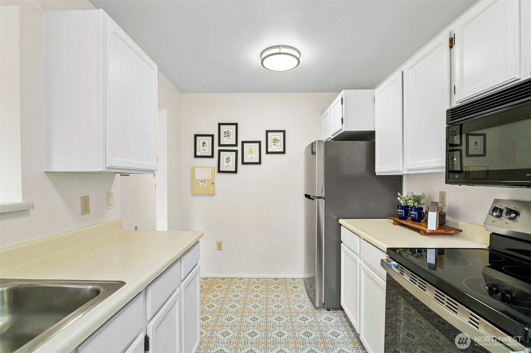 Another View of the Kitchen including New Stainless Steel Appliances.