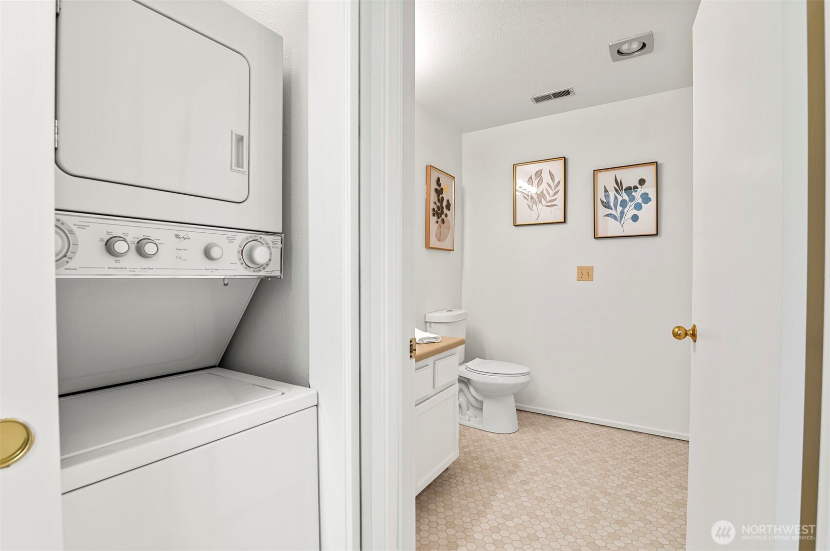 Washer Dryer in Closet next to Half Bath.