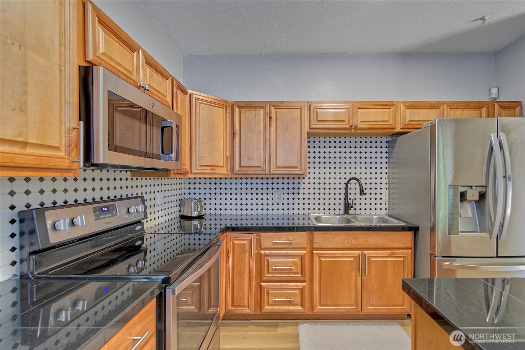 ADU Kitchen with granite counters and center island