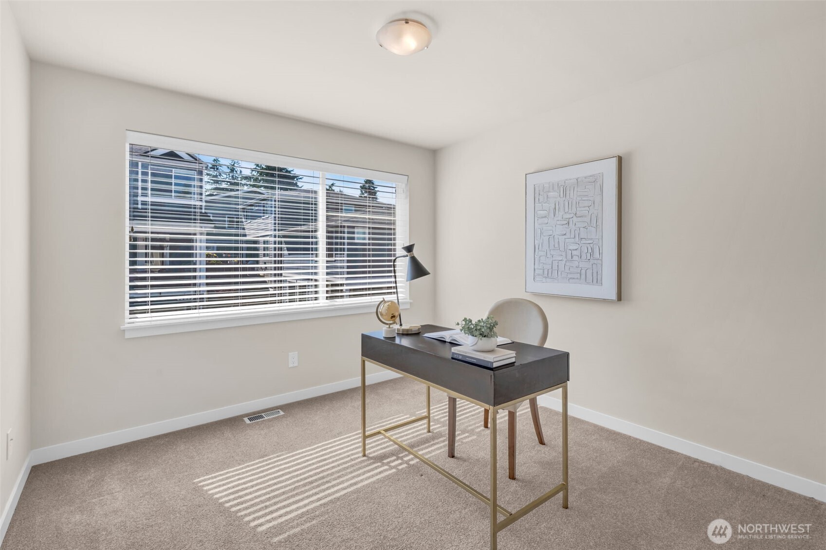1st bedroom upstairs staged as an office.