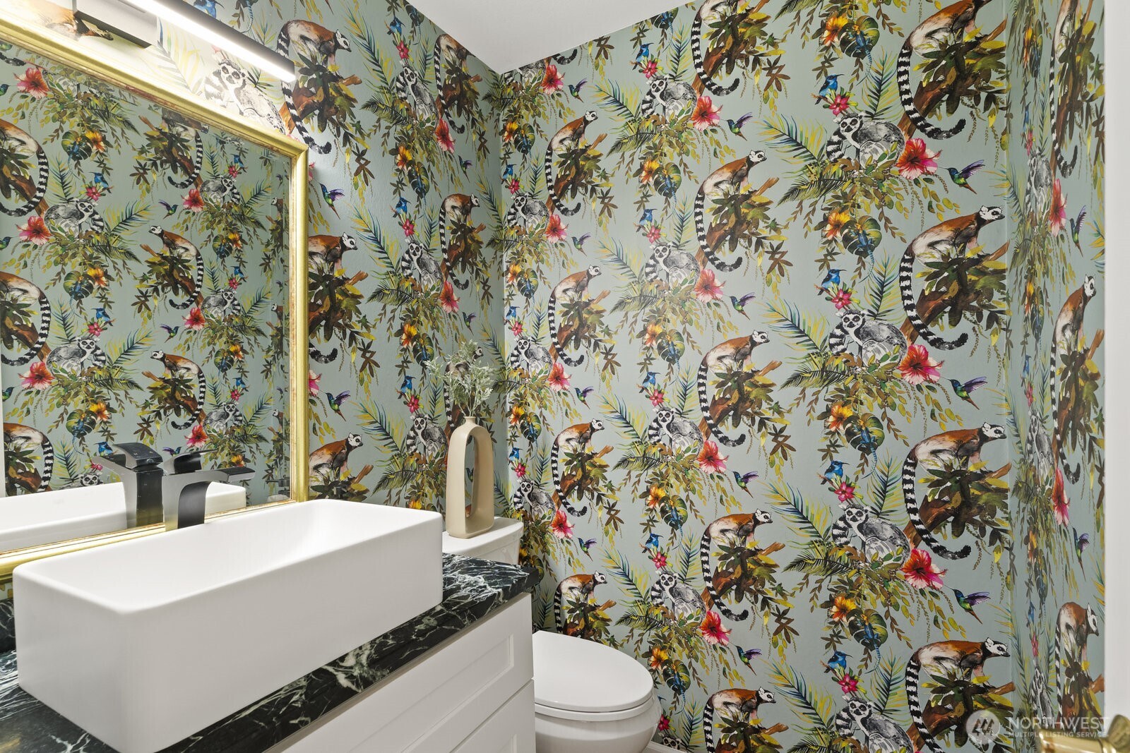 Updated guest powder room with floating sink, new vanity and designer wall covering.