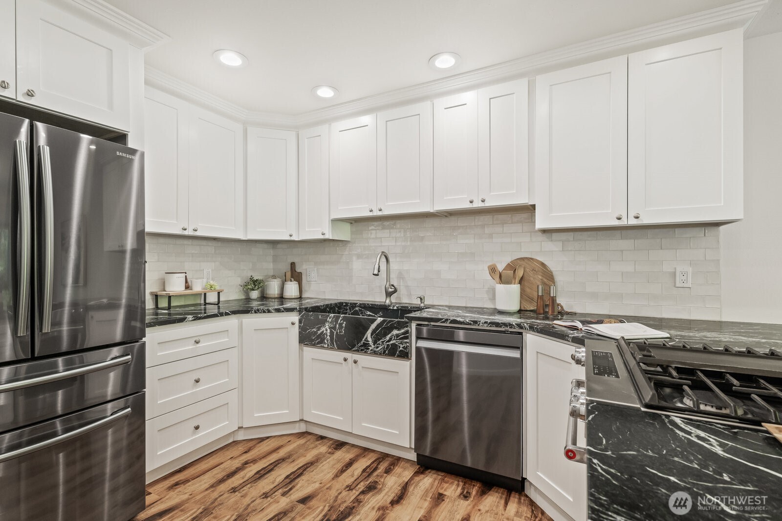 Updated kitchen with soapstone counters, molded farmhouse sink, stainless steel appliances (including gas range)