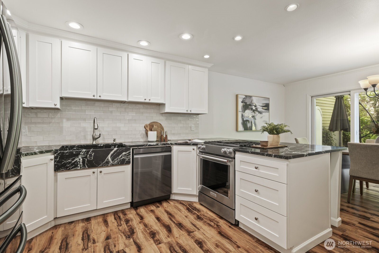 Breakfast bar seating & a walk-in pantry.
