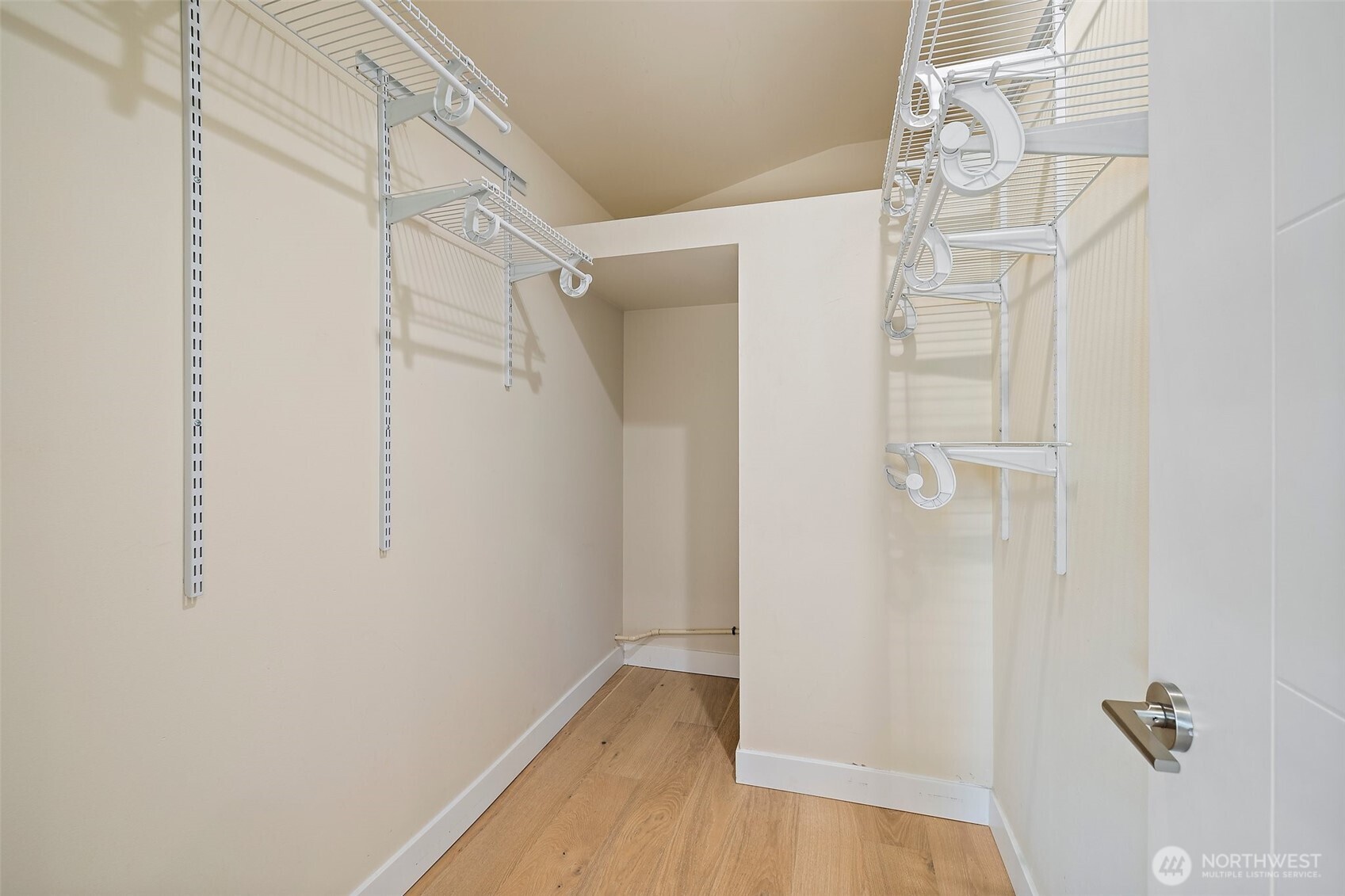 Primary bedroom walk in closet.