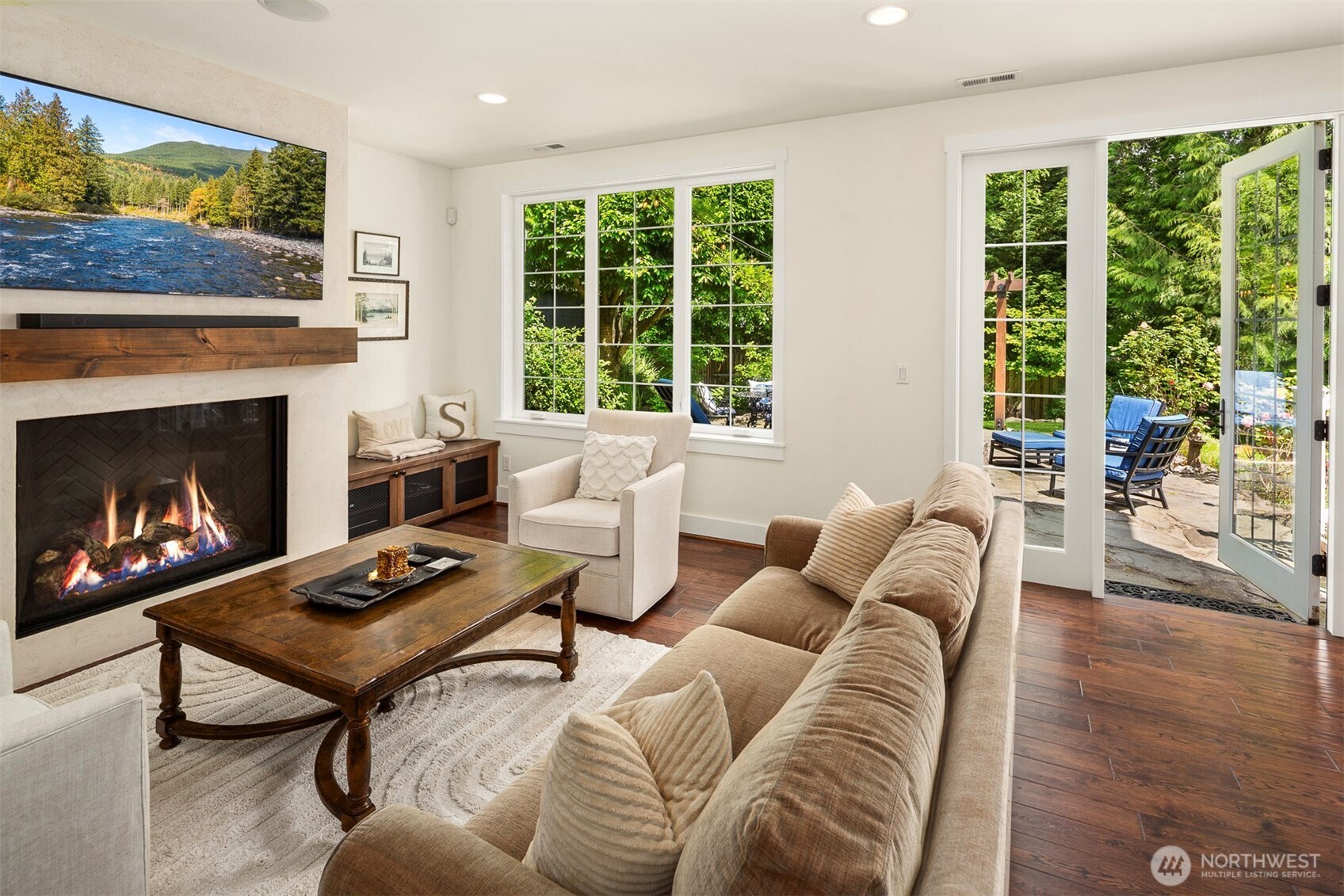 Intimate gathering space off great room offers in to outdoor living or watching a game.