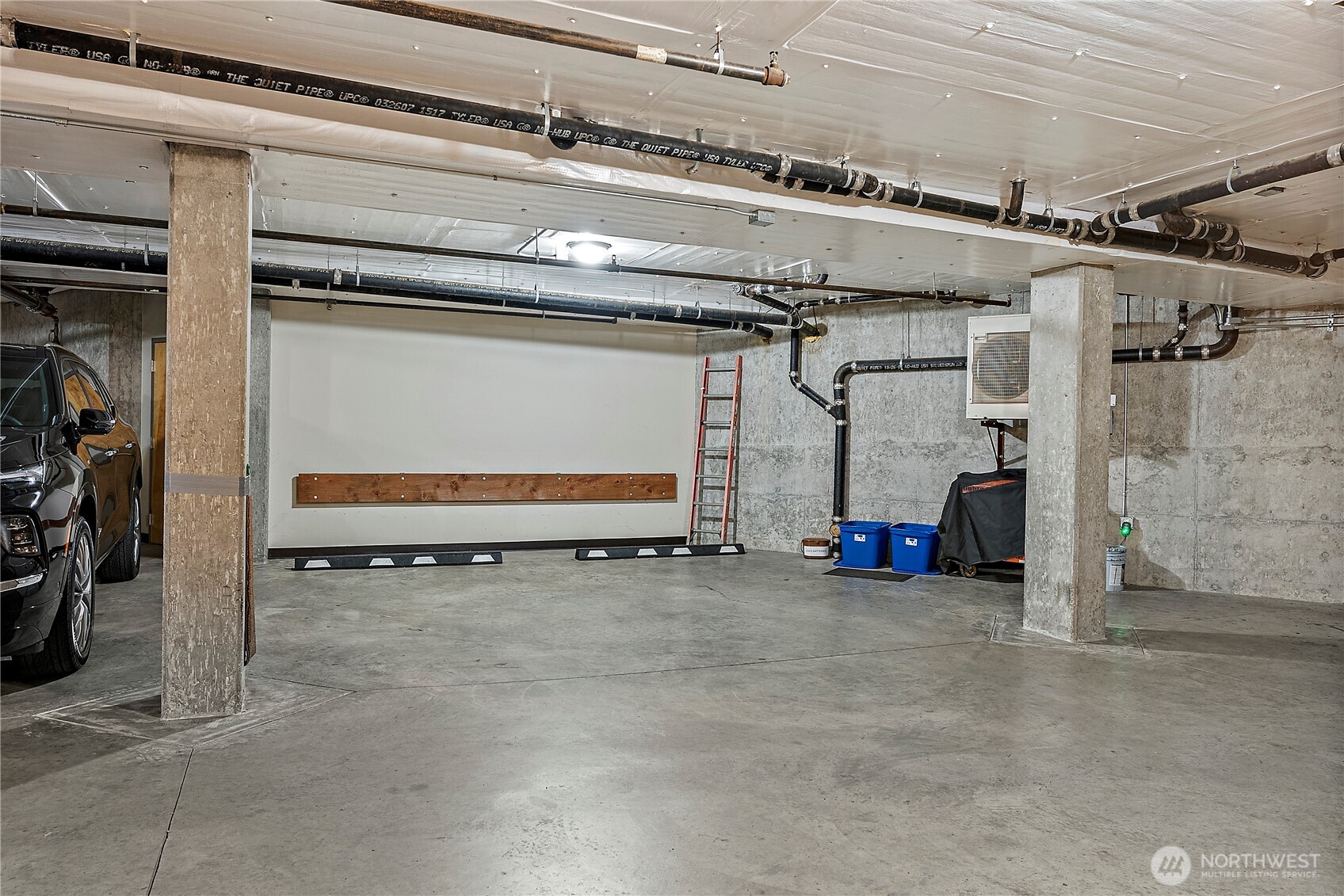 Two dedicated parking spots in basement garage.