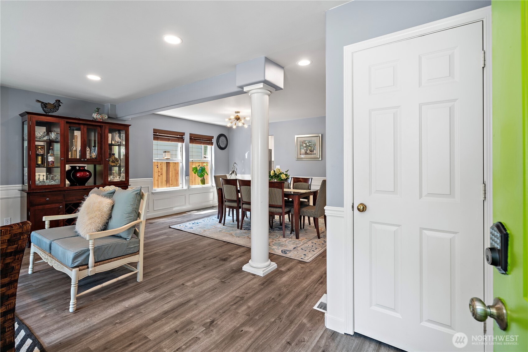 Welcoming main floor entry with storage closet and open living room