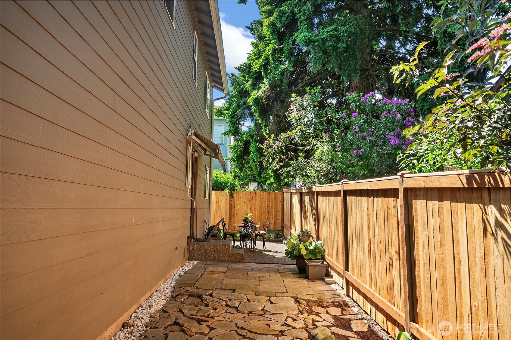 Backyard includes a sizable shed ideal for gardening and camping supplies