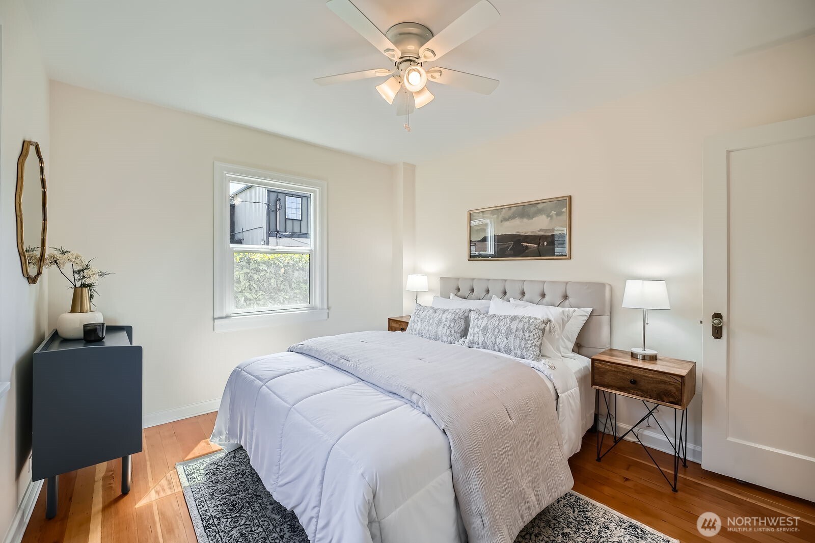 Bedroom one on main floor gets great light and air flow with ceiling fan.